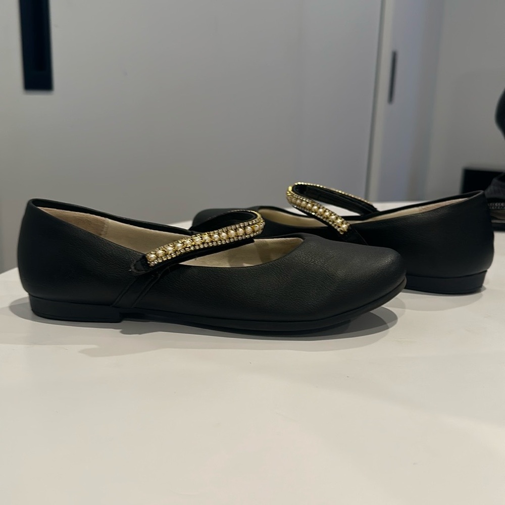 Chic Black Flats with Gold Accents